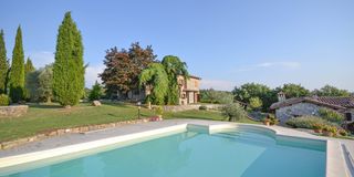 beautiful property with restored farmhouses, pool and land